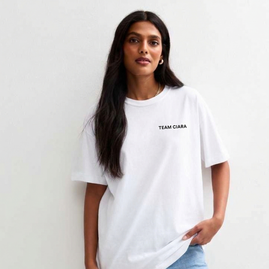 Woman wearing a white t-shirt with 'TEAM CIARA' text against a plain background
