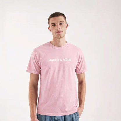 Person wearing a pink t-shirt with 'CARLS A MESS' text on a white background