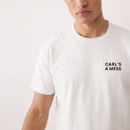 White t-shirt with 'CARL'S A MESS' text worn by a person on a white background