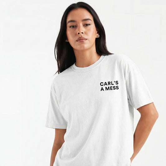 Person wearing a white t-shirt with 'CARL'S A MESS' text on a plain background