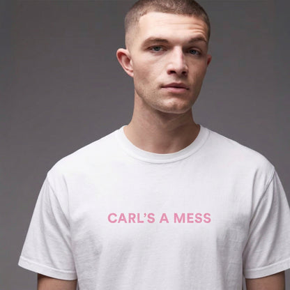 Man wearing a white t-shirt with 'CARL'S A MESS' text in pink on a gray background