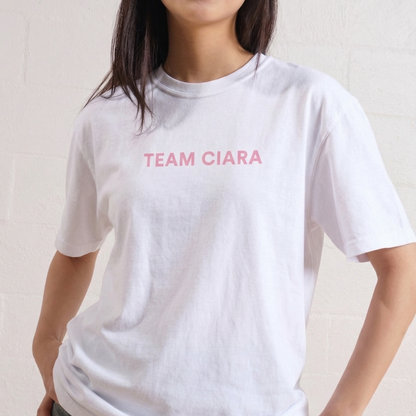Person wearing a white t-shirt with 'TEAM CIARA' printed in red on a plain background