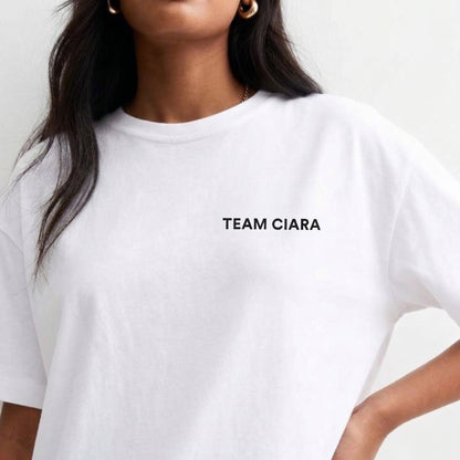 White t-shirt with 'TEAM CIARA' text worn by a person on a plain background