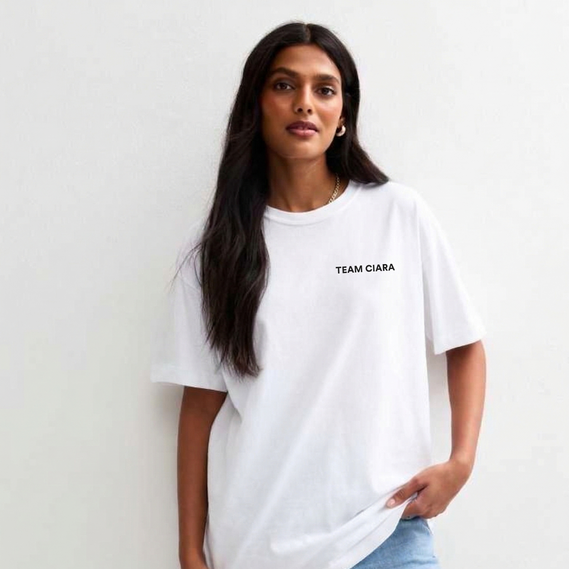 Woman wearing a white t-shirt with 'TEAM CIARA' text against a plain background